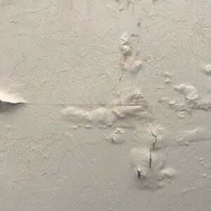 Drywall popcorn ceiling damage