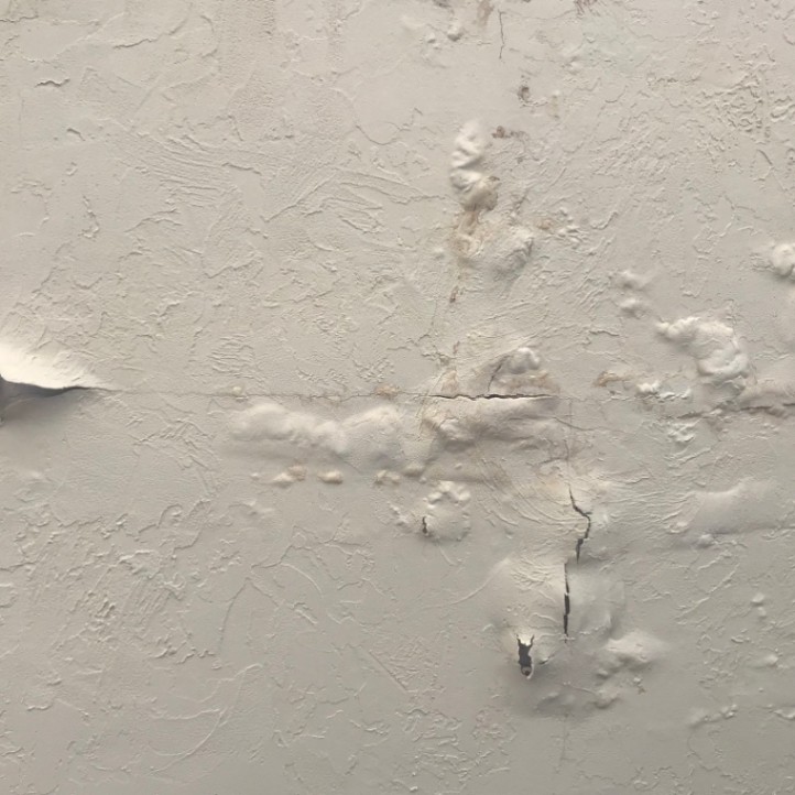 Drywall popcorn ceiling damage