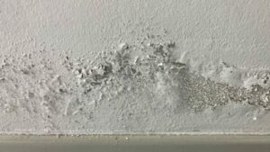 Scratches and dents on ceiling with popcorn structure